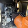 natural gas generator with muffler beside